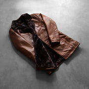 Styled Fit Perspective of Men's Cinnamon Distressed Leather Fur معطف جلد رجالي on Model - Natural Daylight Drape