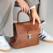 Styled Fit Perspective of Angera Full-Grain Leather Handbag نسائي on Model - Natural Daylight Drape