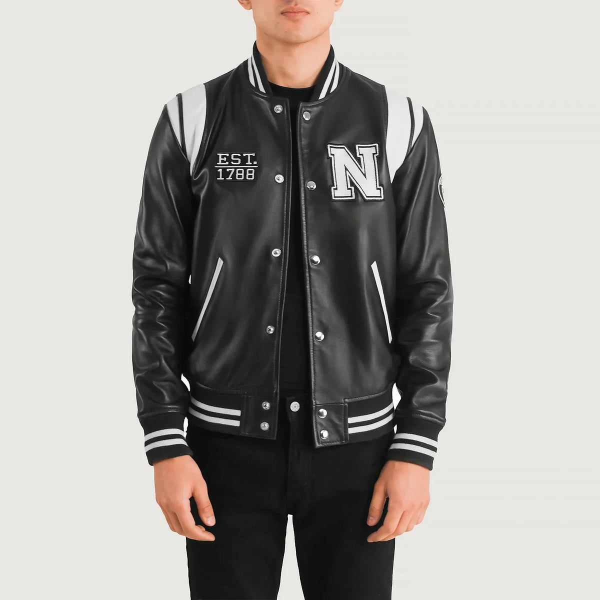 
Liberte New York أسود Leather Varsity جاكيت جلد رجالي in Black & White Sheepskin Leather - عرض أمامي وقَصّة مفصلة أنيقة | شراء أونلاين عبر المتجر الرسمي
